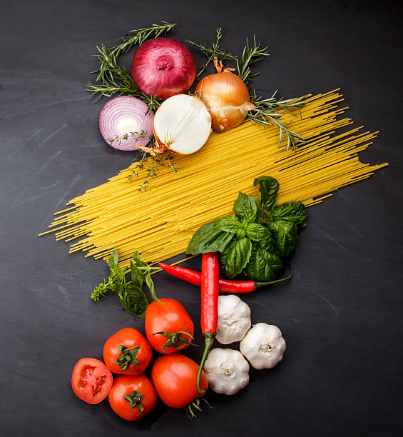 istock italian food ingredients on black board for background 611987886