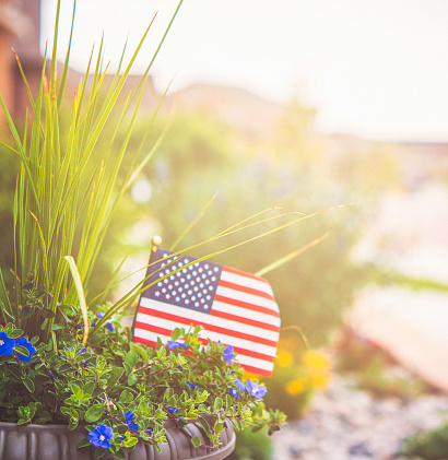 Garden planter with flowers and US flag for American holidays