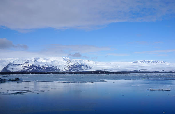 istock ice sheet on the water with snow mountain background 611991576