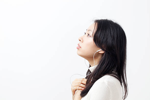 istock Woman listening to music 611994362
