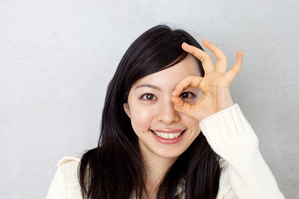 istock Woman making ok sign 611994630