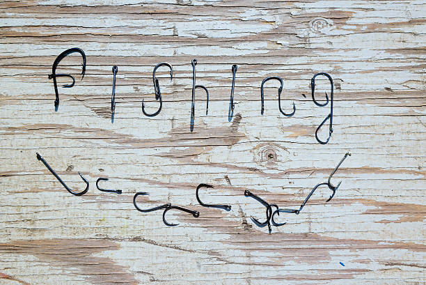 istock Fishing sign on the board top view 611997604