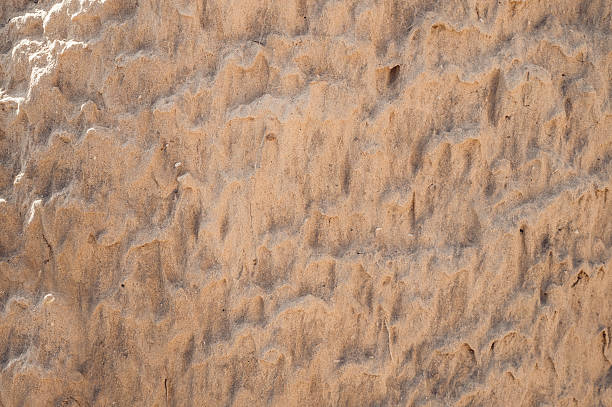 istock Texture of wet sand 611997898
