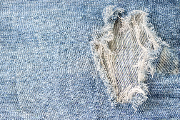 istock Closeup denim jeans texture,The old jeans background 611999596