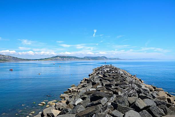 istock Breakwater leading to sea, Lyme Regis. 611999956