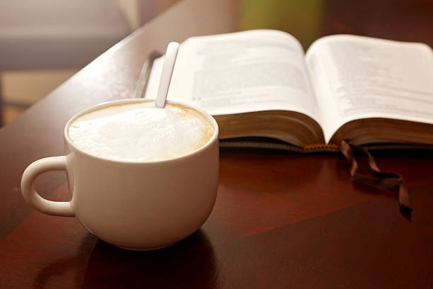 istock Holy Bible Open on a Wooden Table 611999964