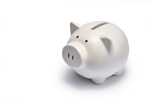 White pink piggy bank isolated on white background.