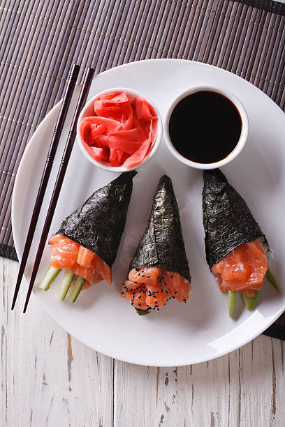 istock Japanese food: Salmon temaki closeup. vertical top view 612003370