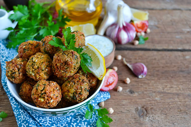 Falafel - deep fried balls of ground chickpeas with tahini sauce from