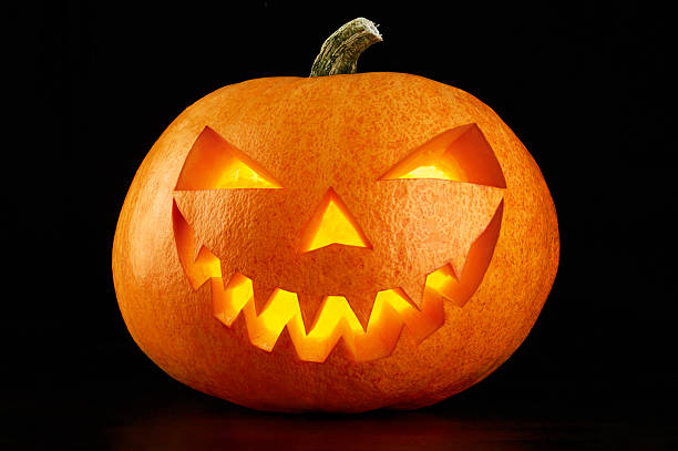 istock Evil Halloween pumpkin head on a dark background 612004388