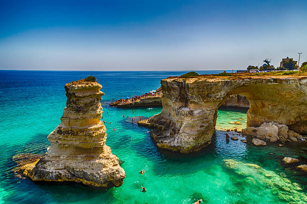 Stacks on the coast of Salento in Italy Rocky stacks of Santo Andrea on the coast of Salento in Puglia in Italy salento puglia stock pictures, royalty-free photos & images