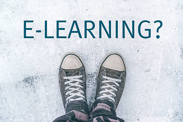 istock Teenager standing over e-learning title on street 612005952