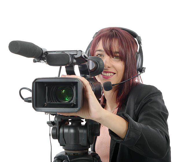 istock young woman with a professional video camera 612007002