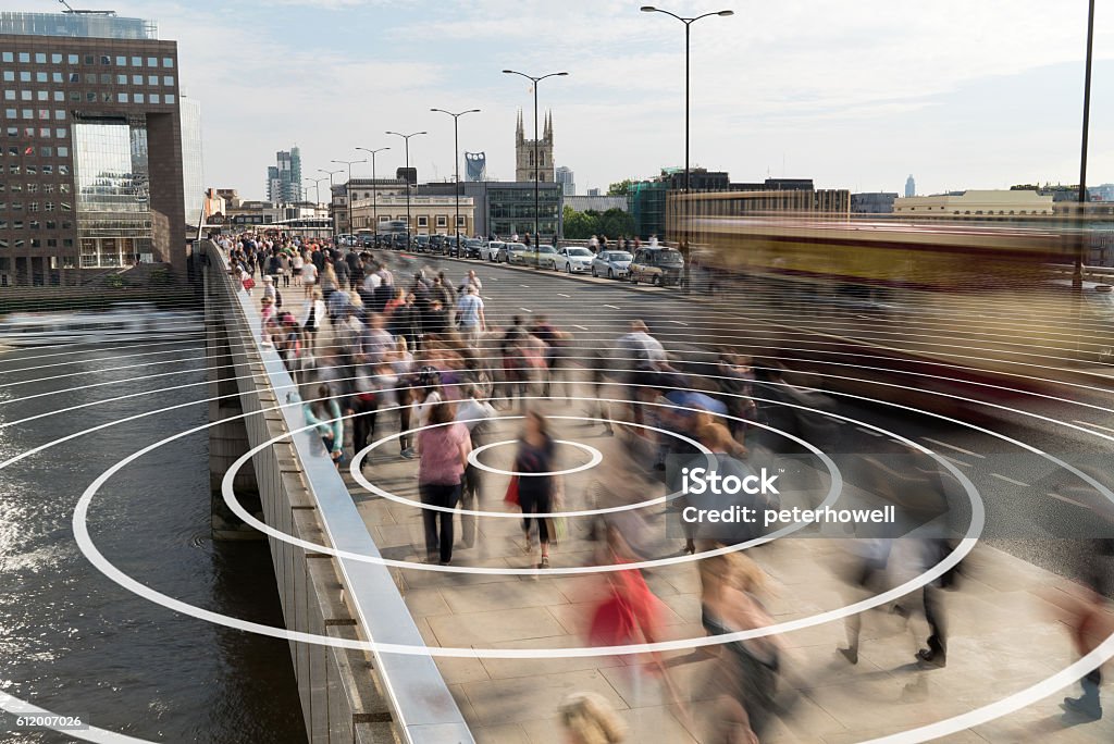 Phone signal from a person on a London bridge. Signal from a phone shown as concentric rings coming from a pedestrian walking on London Bridge. Surveillance Stock Photo