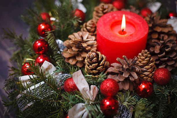 istock Decorated Christmas wreath with a candle close-up 612007198