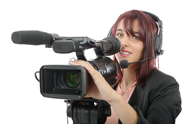 istock young woman with a professional video camera 612007312