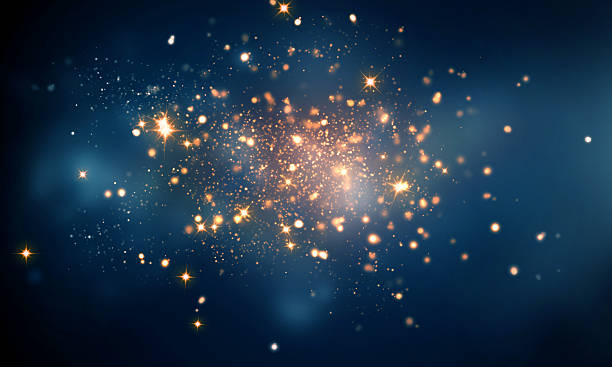 scintille di fuoco in sfondo bokeh blu scuro - space galaxy star glitter foto e immagini stock