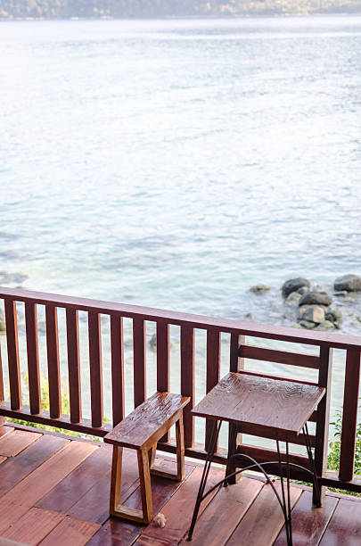 istock Wooden chairs and tables on the terrace 612008194