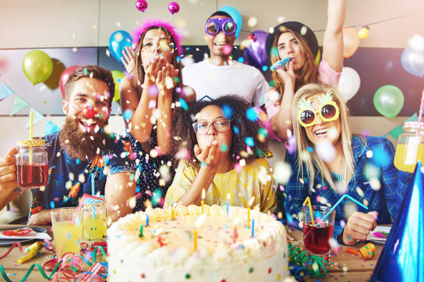 Confetti flying around group celebrating a party