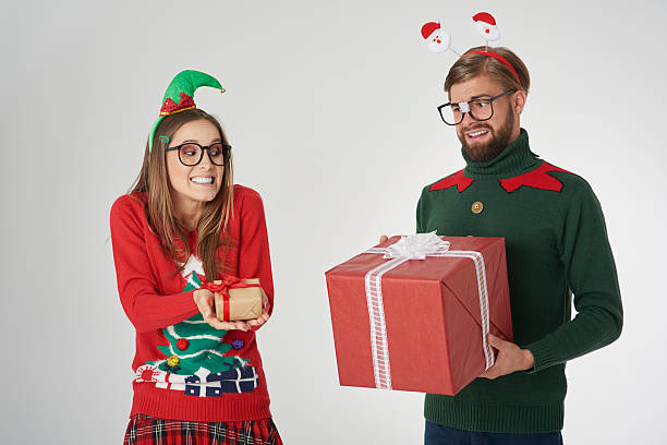 istock Exchange of big and small Christmas presents 612010636