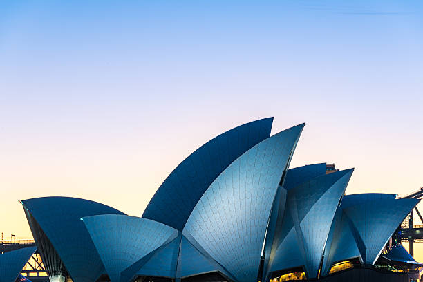 Roof of famous Australian tourist attraction Sydney Opera house Sydney, Australia - July 3, 2016: Sydney Opera House at blue hour. Roof of famous Australian sightseeing and tourist attraction - Sydney Opera house opera house stock pictures, royalty-free photos & images