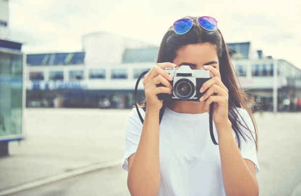 istock Young woman photographing the camera 612014154