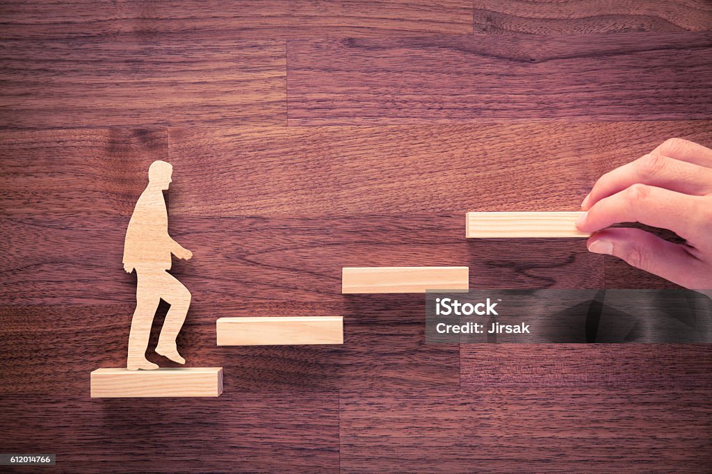 Personal development career Personal development, personal and career growth, progress and potential concepts. Coach (human resources officer, manager, mentor) motivate employee to growth. Staircase Stock Photo