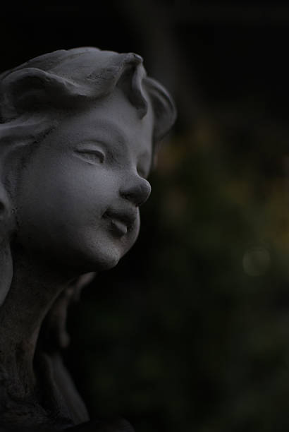 istock Gray angel plaster statue, Low key 612015036