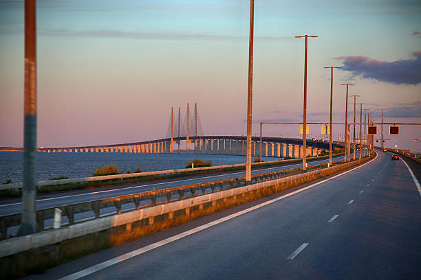 Oresund Bridge view from Malmo Sweden showing long cable stayed structure across the sea under blue sky