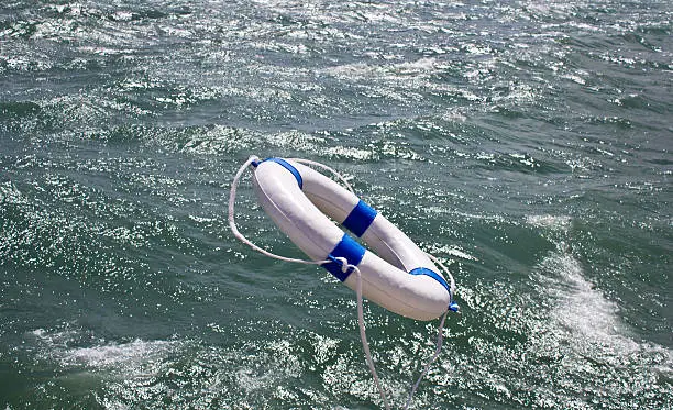 Lifebuoy, lifebelt, lifesaver in dramatic ocean storm as a help equipment