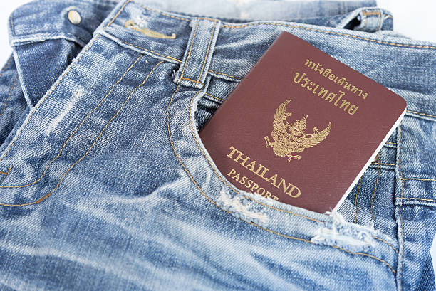 The old jeans with passport. The old jeans with passport for prepare to traveling in anywhere. jeans denim passport pocket stock pictures, royalty-free photos & images