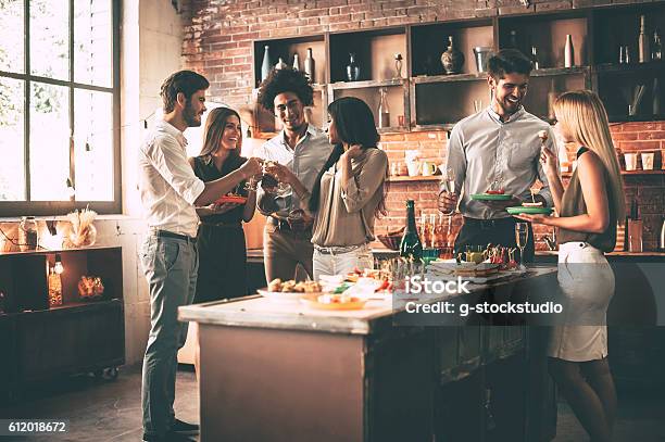 Enjoying Party With Nearest Friends Stock Photo - Download Image Now - Party - Social Event, Kitchen, Friendship