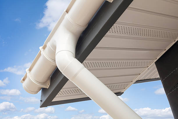 istock SIP panel house construction. Metal tile roof with rain gutter 612018730