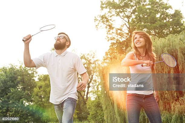 Playing Badminton Stock Photo - Download Image Now - Badminton - Sport, Public Park, Fun