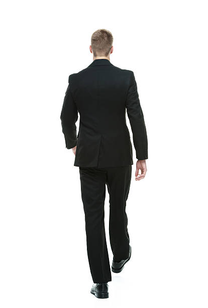istock Rear view of businessman walking 612021474