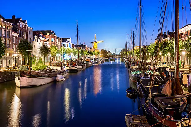 Picturesque Delfshaven in Rotterdam at Twilight, The Netherlands. Its small historic centre has been carefully preserved and it escaped the Second World War bombing raids.