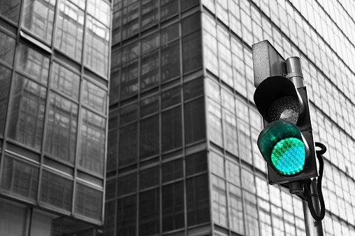 Traffic light with urban background