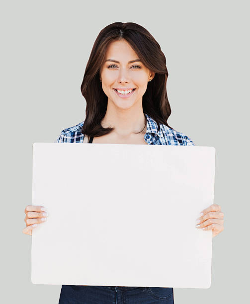 istock Happy woman showing white banner 612023606