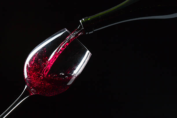 istock bottle and glass with red 612023988