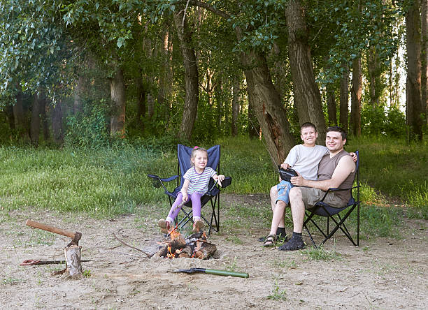 istock people camping in forest, family active in nature, kindle fire 612024084