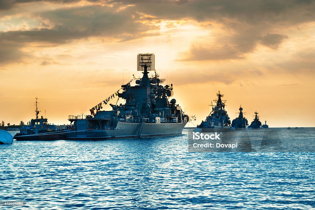 Military navy ships in a sea bay Military navy ships in a sea bay at sunset time Navy Stock Photo