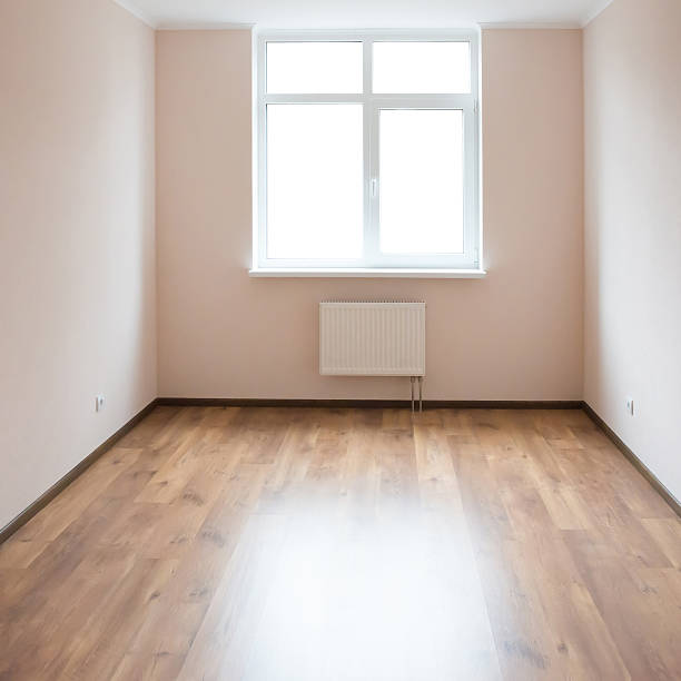 istock Empty room with window and wooden floor 612024676