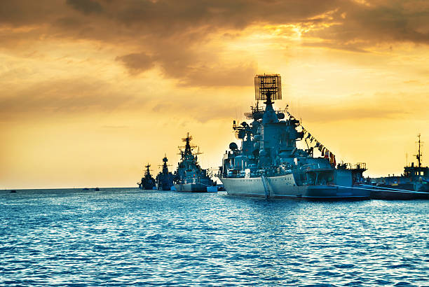 istock Military navy ships in a sea bay 612025326