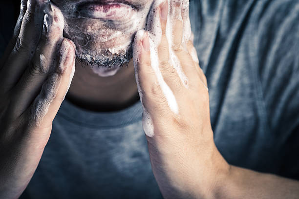 Men cleansing Men cleansing beard stock pictures, royalty-free photos & images