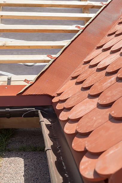 istock New roof under construction with wooden beams 612026604