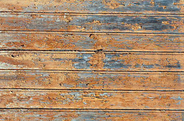 istock Orange weathered wood house wall 612027466