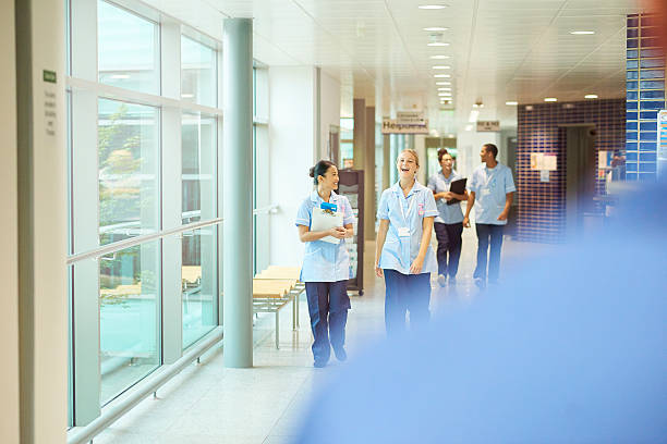 istock happy young nurses on the hospital wing . 612027516