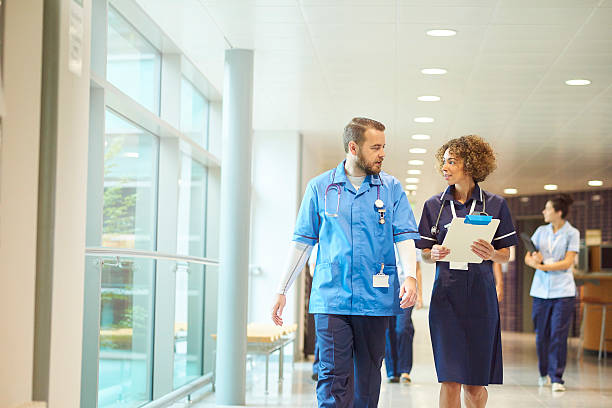 istock male nurse with senior nurse 612027898