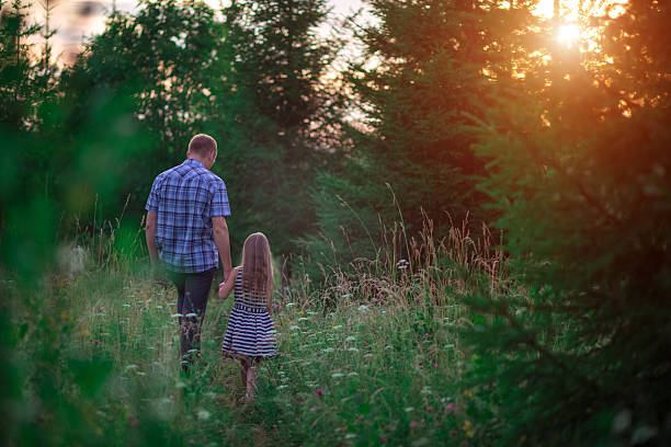 istock Dad and daughter at sunset 612029360