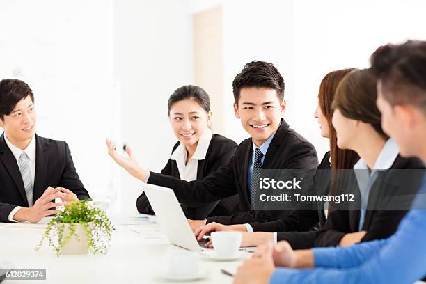 Group Of Happy Young Business People In Meeting Stock Photo - Download Image Now - Japanese Ethnicity, Business, Business Meeting